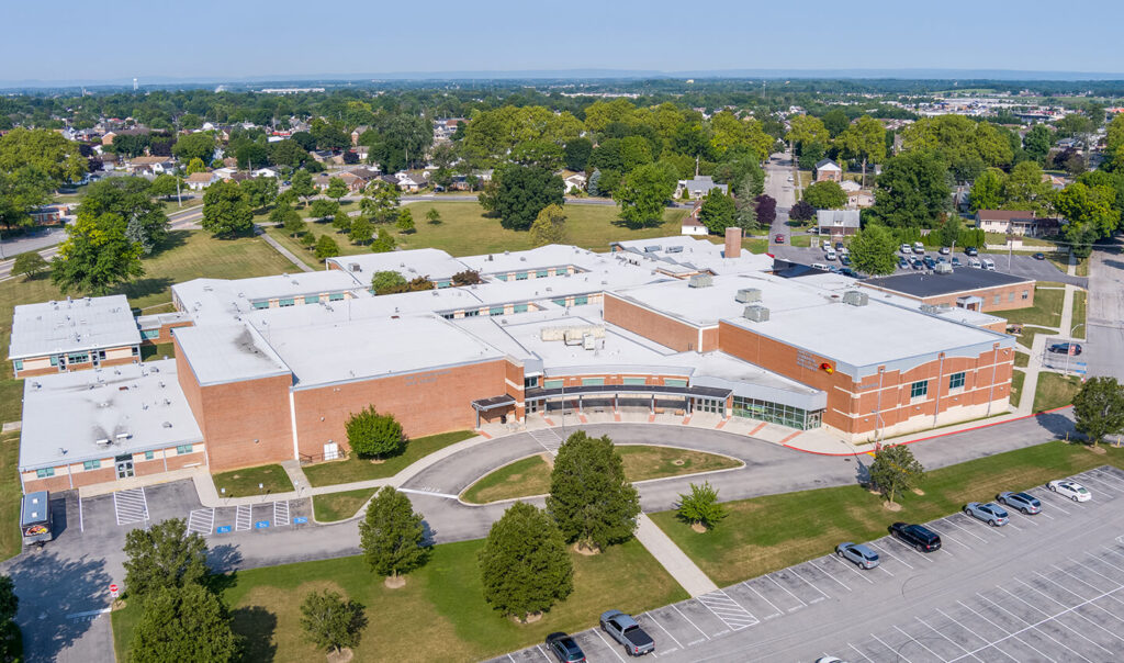 Aerial view of a large facility's roofing system.