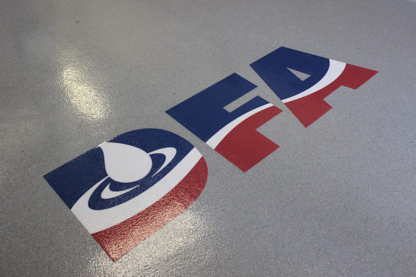 Dairy Farmers of America logo on a new epoxy floor.