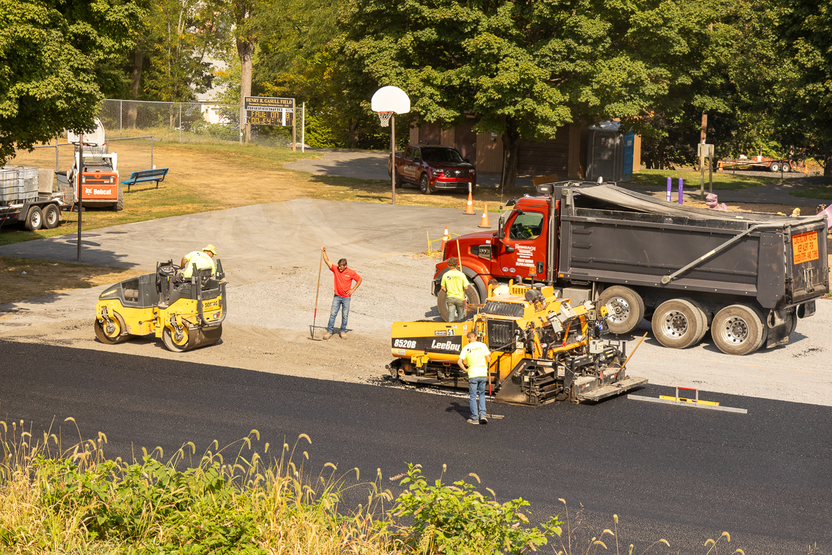 Houck team restoring the damaged tennis court.