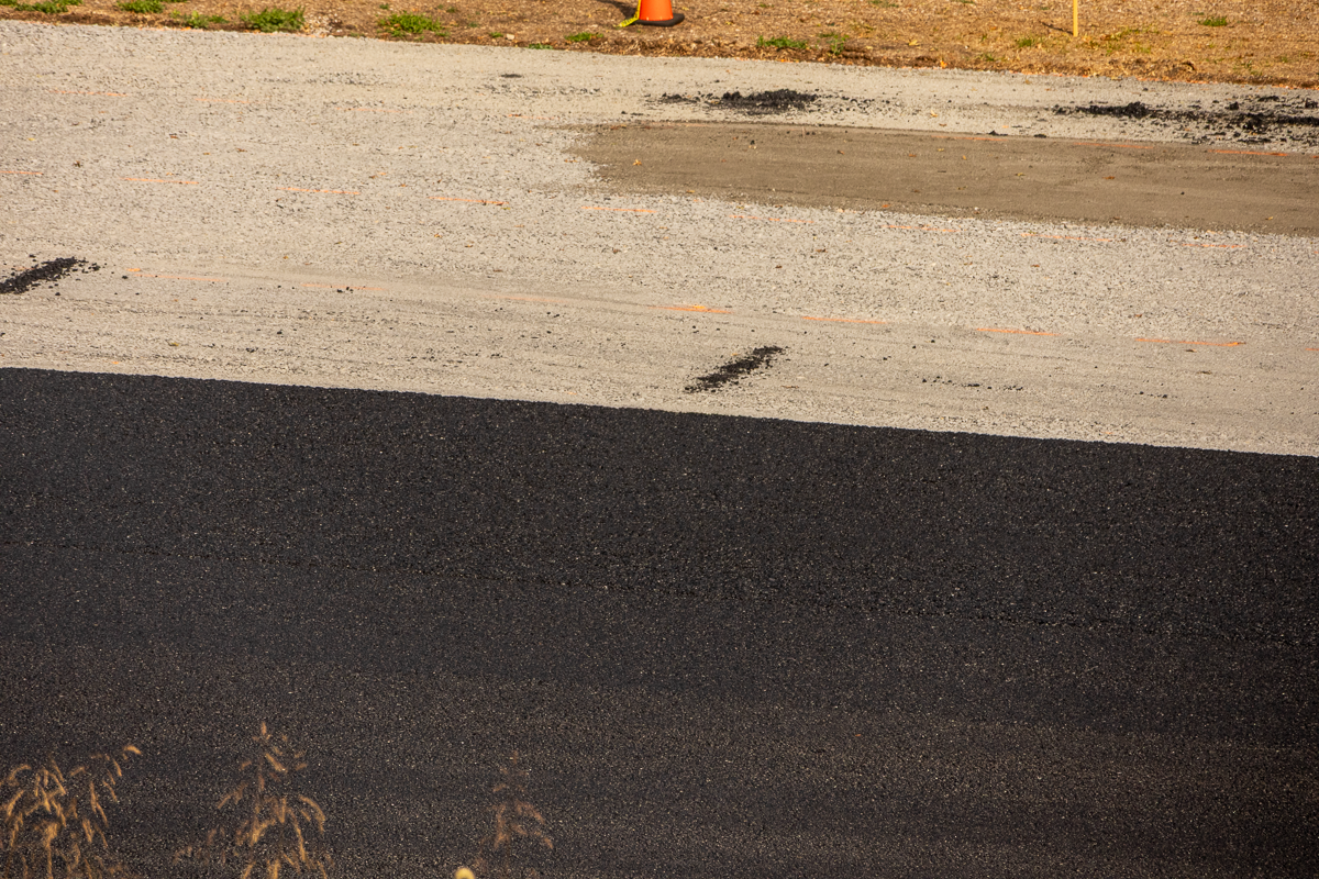 Close up view of the tennis court during the repaving process.