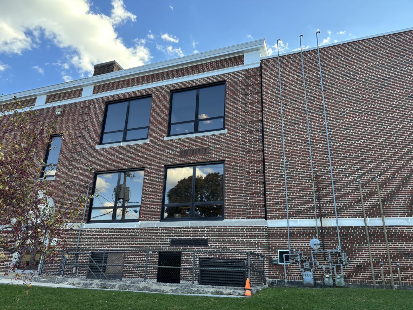 Side view of newly restored brick facade around windows.
