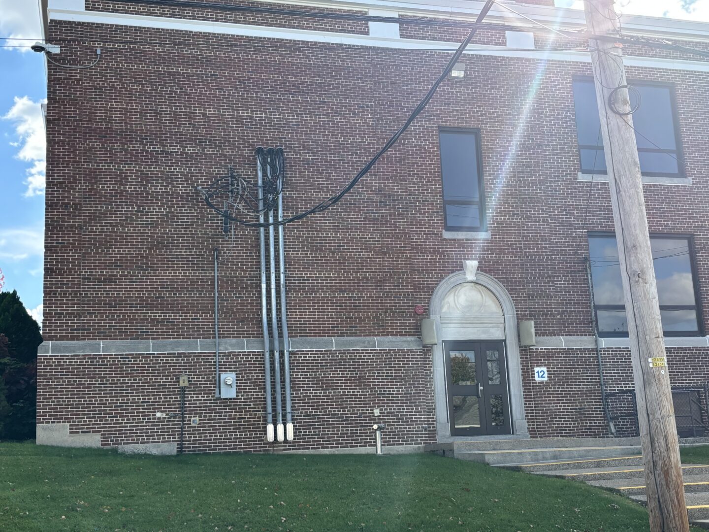 Exterior view of newly restored concrete steps outside of elementary school building.