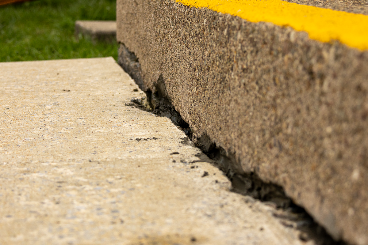 Close up view of cracked concrete steps.