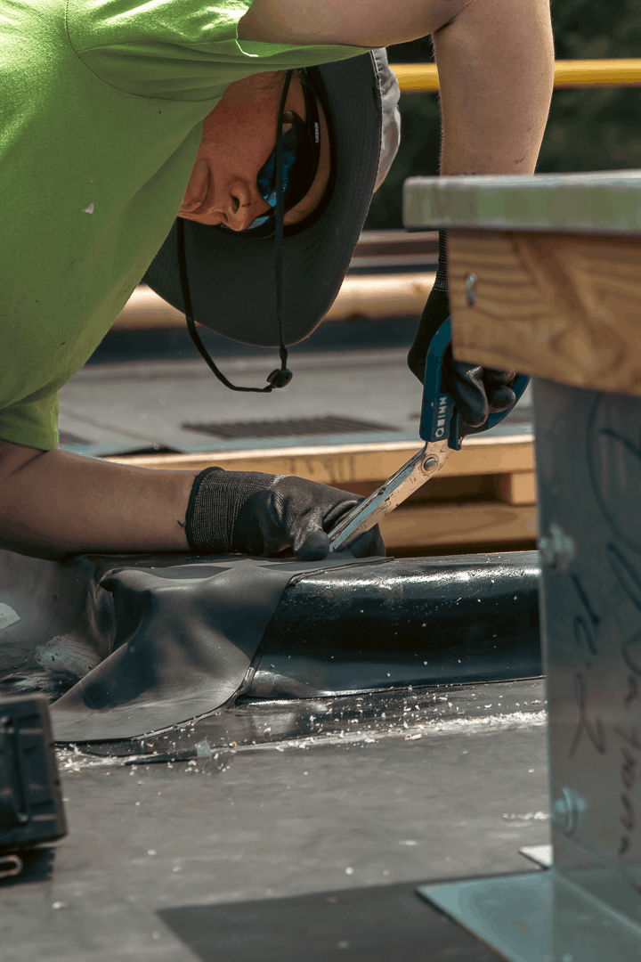 Close up of Houck team repairing roof.