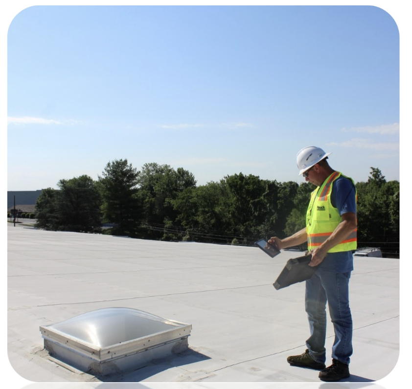 Team member doing a roof maintenance check.