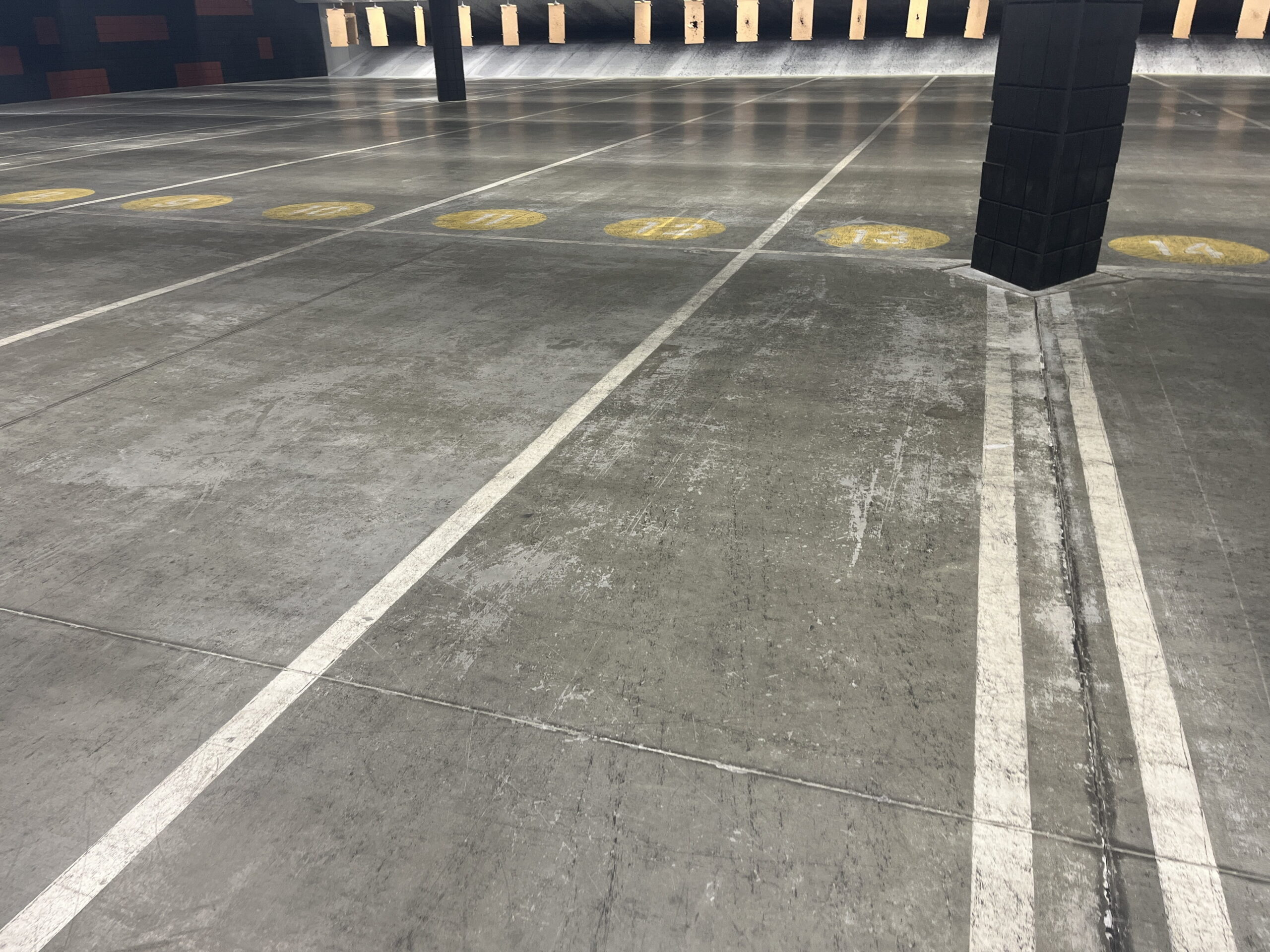 Close up of epoxy line striping on concrete floor.